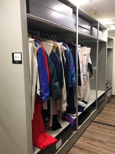historical costume storage on grey mobile shelving system